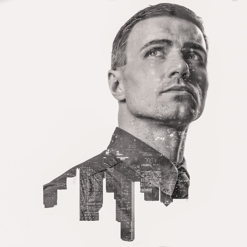 double exposure of city buildings and man