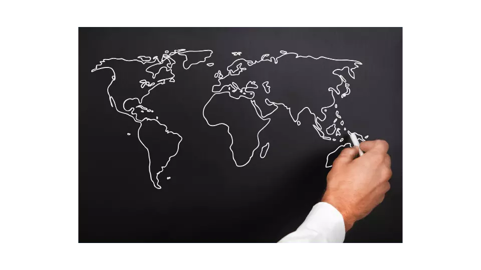 hand drawing world geography on chalkboard